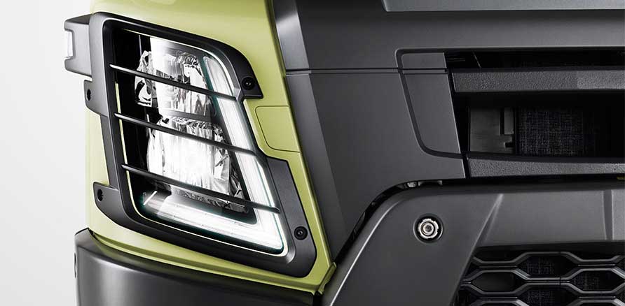 Volvo FMX 440 8x4 Tipper front headlight view